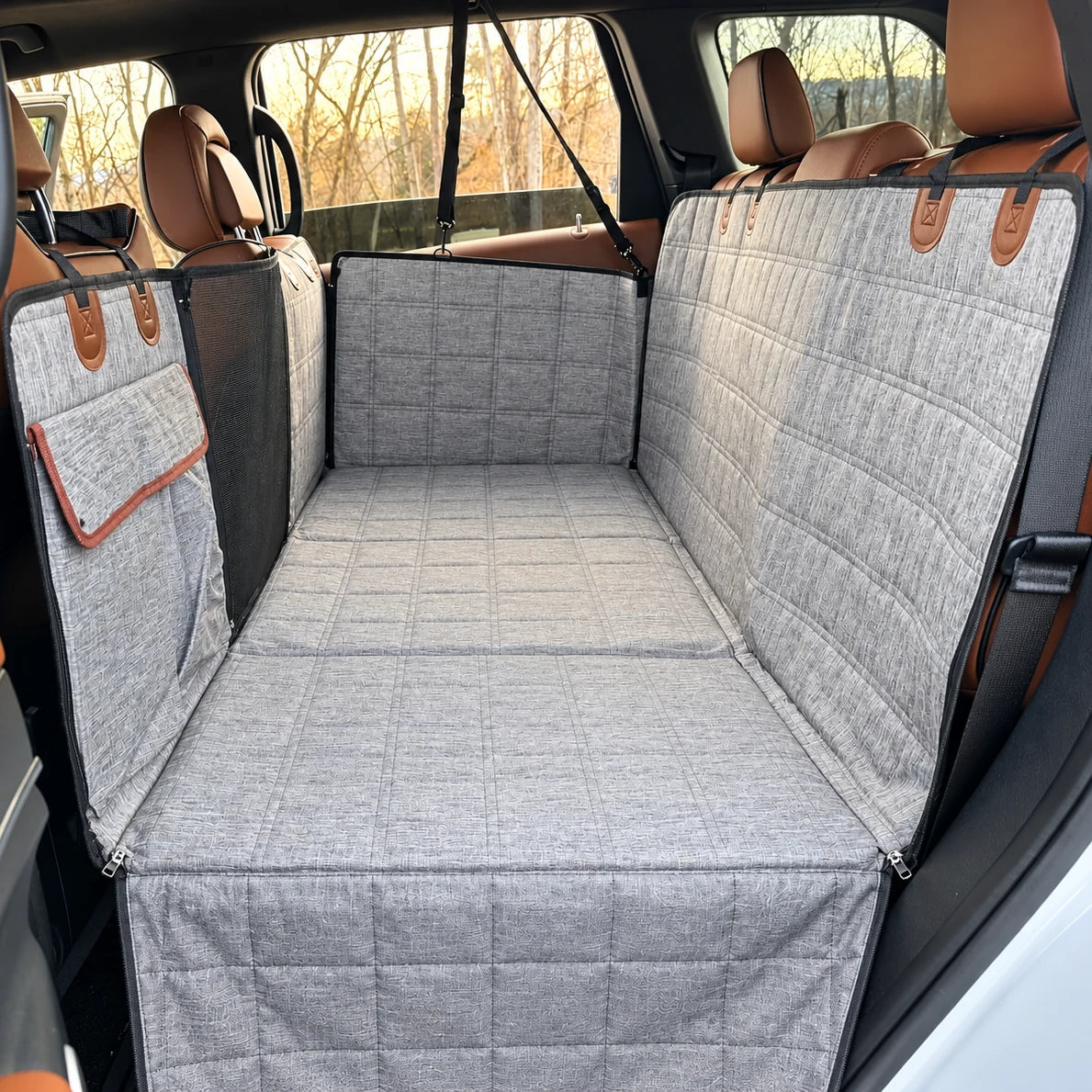EMPITI RoadDeck back seat extender in Stone Grey installed in an SUV